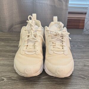 White/cream with gray accents. Womens Nikes